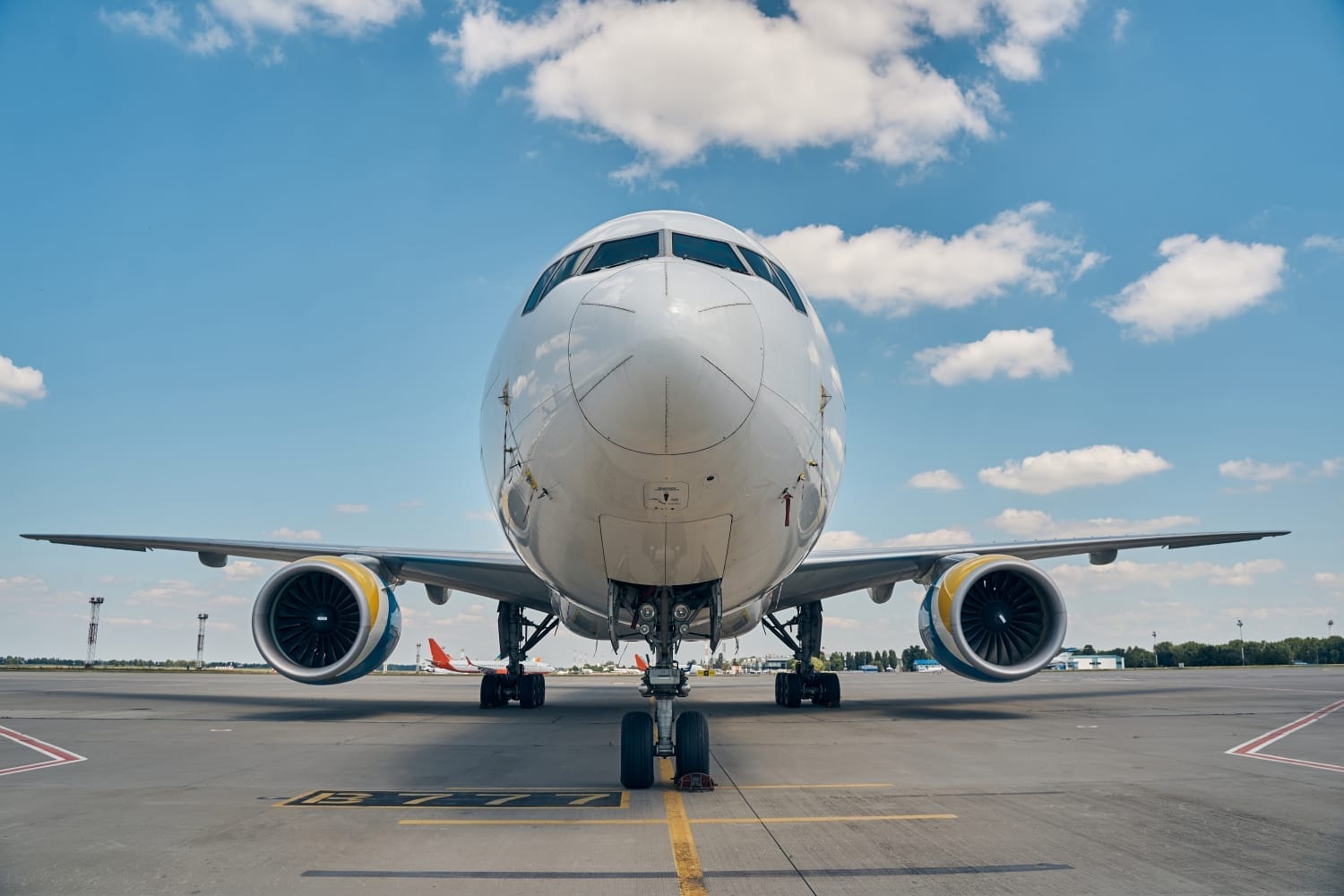 Front view of a large passenger airplane on the tarmac, ready for air freight transport. -Shipping Company in Egypt
